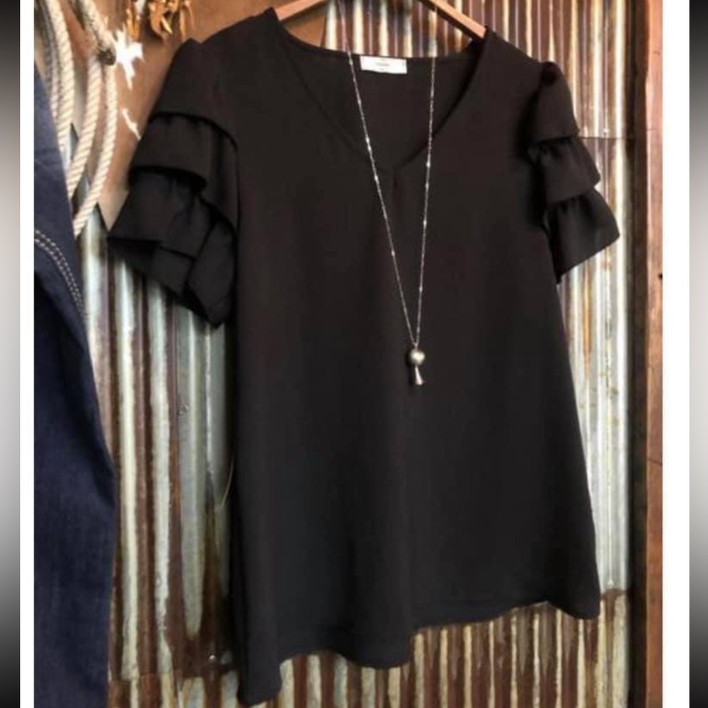 Savanna 7’s top. Brand new, never worn. Size medium
